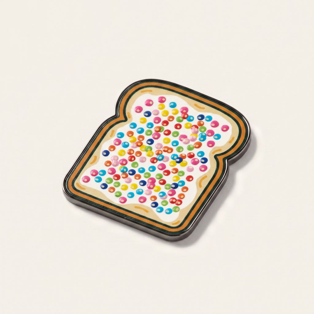 The Birthday golf ball marker, a slice of bread covered in raised hundreds and thousands, photographed at an angle.