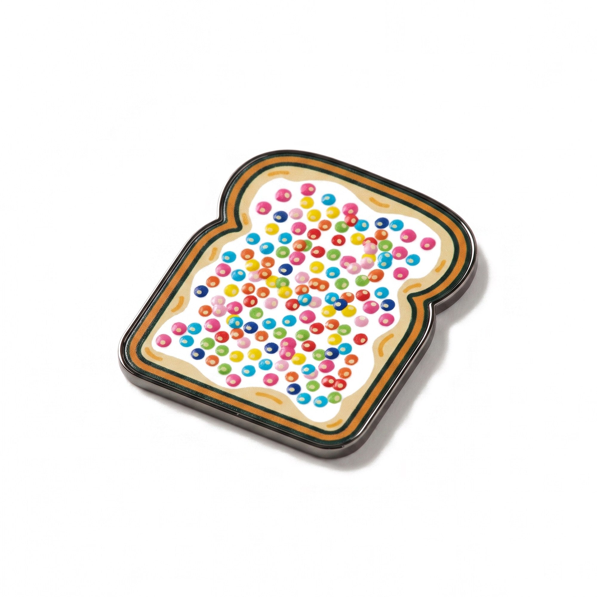 The Birthday golf ball marker, a slice of bread covered in raised hundreds and thousands, photographed at an angle.