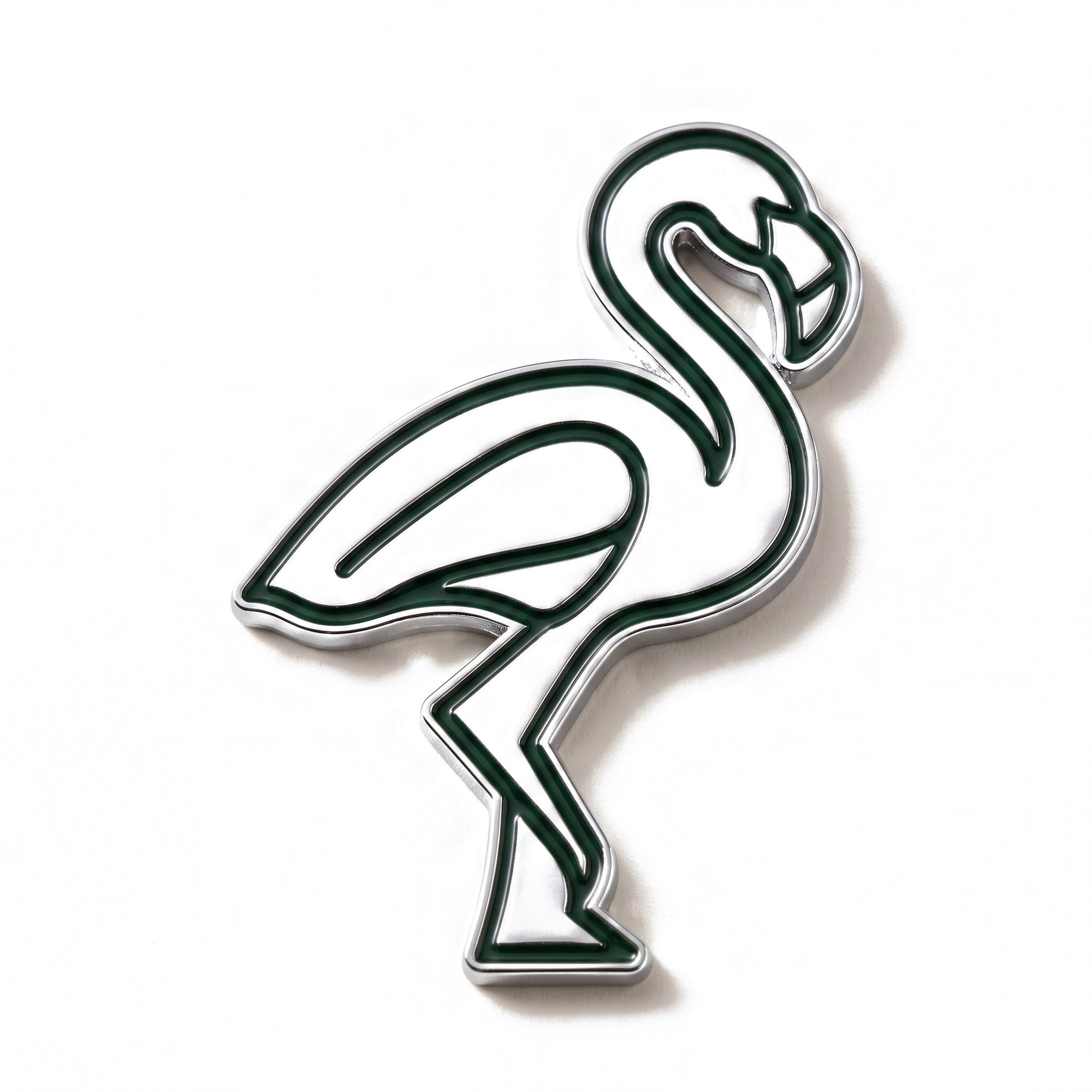 The Flamingo golf ball marker photographed flat from above, showing the full silhouette and chrome finish.